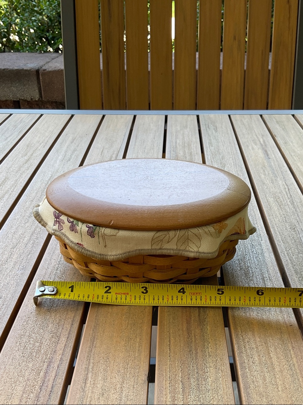 Longaberger oval woven basket with wood lid and floral cloth trim-New condition